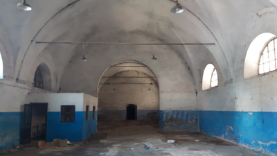 Compendio costituito da: 1)edificio principale a pianta rettangolare, con dimensioni di circa 85m x 12m, con due piani fuori terra; 2) secondo fabbricato, posto all’angolo con via Benedettine ed edificato su due piani fuori terra, con ingresso dall’interno del piazzale scoperto accessibile da via Benedettine. Identificativi catastali: C.T. Fg.116 P.lla 206 - C.F. Fg. 116 P.lla 206 Sub. 1-3-4-6-8-9