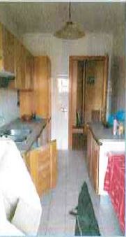 Ingresso, corridoio, salone, disimpegno, cucina, bagno, camera e 2 balconi N.C.E.U. Unità Residenziale cat. A/2 foglio 648, part. 325, sub. 57 + pertinenziale posto auto coperto n. 8 piano terra N.C.E.U. unità secondaria cat. C/6 foglio 648, part. 325, sub 550